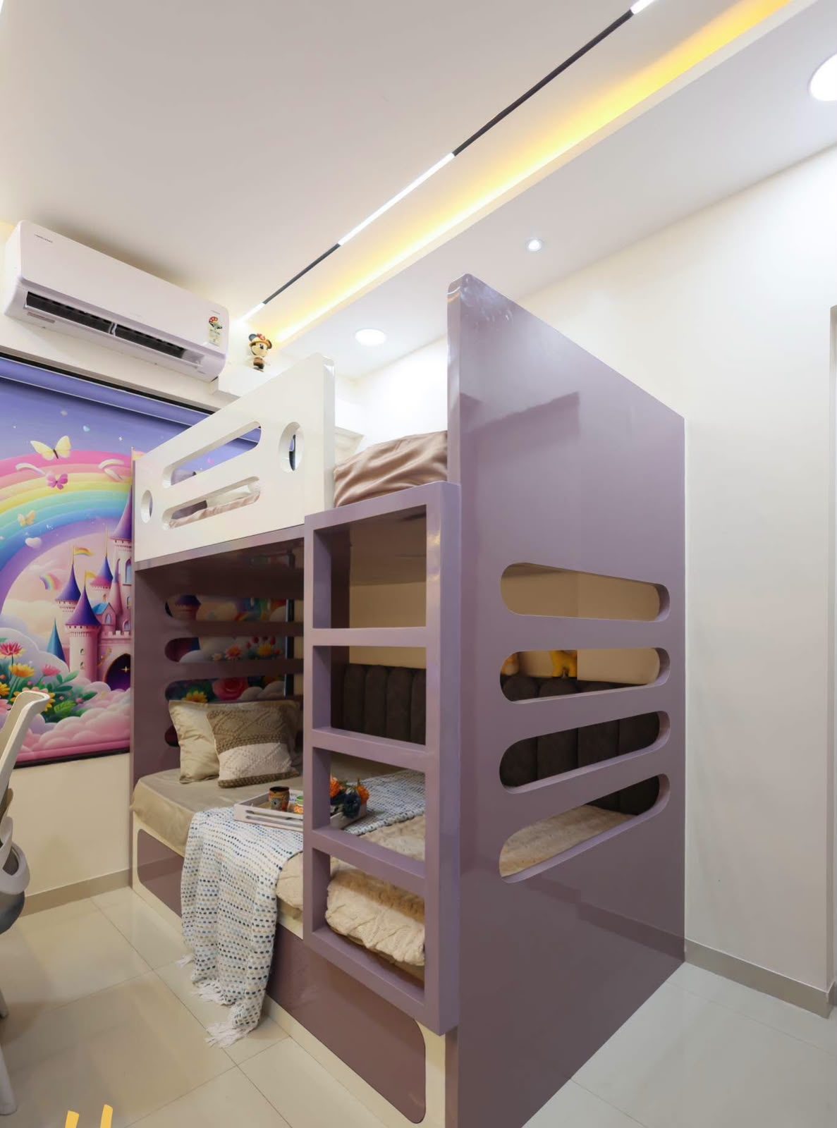 Children's room with bunk beds and rainbow mural